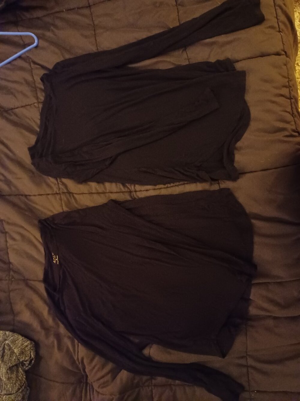 2 black long sleeve shirts
